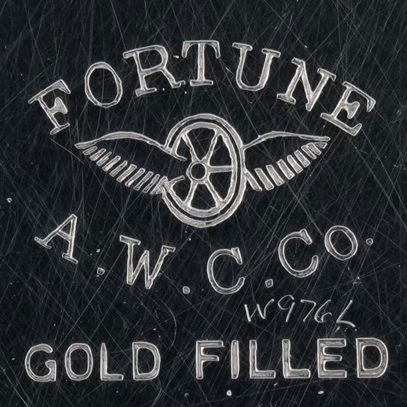 Watch Case Marking for American Watch Case Co. of Toronto, Ltd. Fortune Fortune Winged Wheel A.W.C.Co. Gold Filled Case Made in Canada