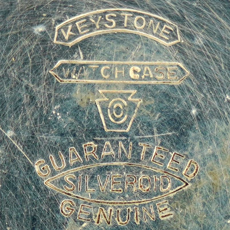 Watch Case Marking for Keystone Watch Case Co. Silveroid Keystone Watch Case Co. Guaranteed Silveroid Genuine Silveroid in Pointed Ribbon